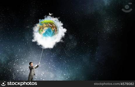 World in his hands. Businessman catch Earth planet with rope . Elements of this image are furnished by NASA