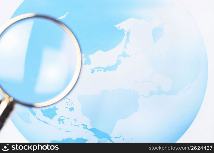 World map and Magnifying glass