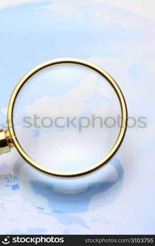 World map and Magnifying glass