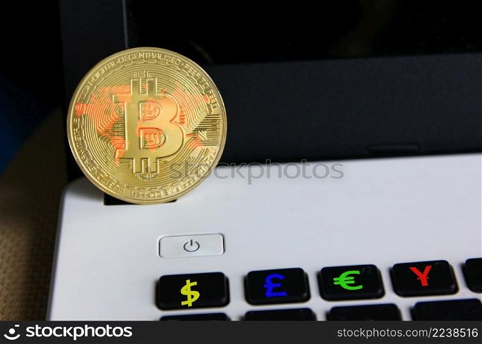 world map on bit coin with power button on laptop , money sign on button