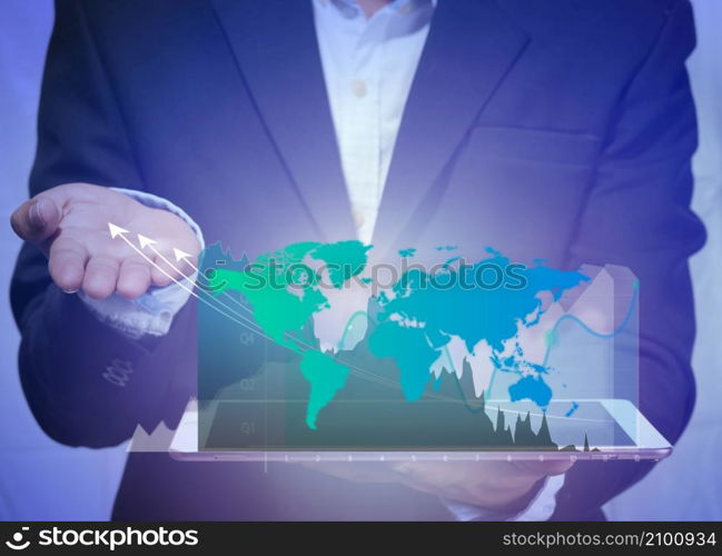 world market trading concept with digital tablet in the human hand and digital finance chart and world map on dark background with copy space. virtual world online marketing concept Metaverse.