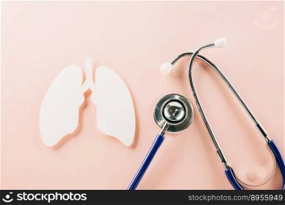 World TB Day. Top view of lungs paper symbol and medical stethoscope on pink background, copy space, lung cancer awareness, concept of world tuberculosis day, banner background, pneumonia