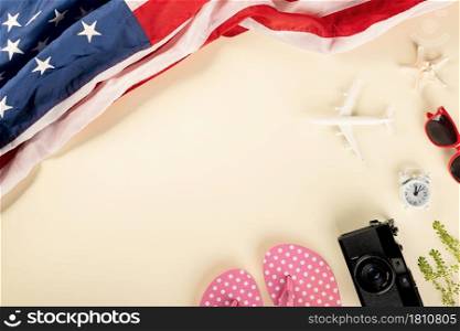 World Tourism Day, Top view model plane, camera and American flag, Holiday accessory beach trip travel vacation flight visa to USA is opened after coronavirus
