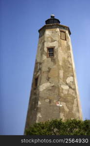 Worn and weathered lighthouse on Bald Head Island, North Carolina.