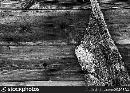 Worn wooden background with old boat&acute;s rudder