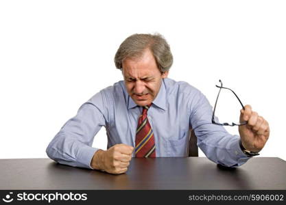 worried business man on a desk, isolated on white