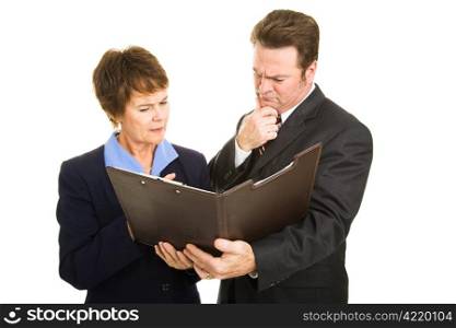 Worried business partners going over the latest financial report. Isolated on white.