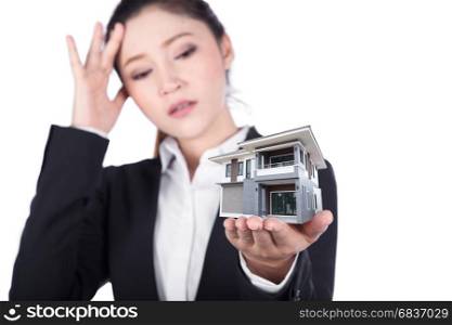 worried business woman open hand holding house isolated on white background