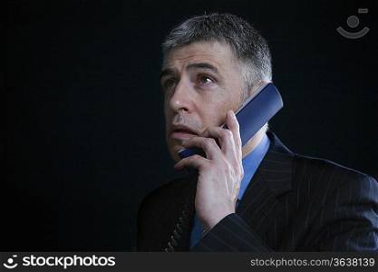 Worried Businessman on the Telephone
