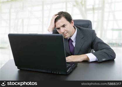 worried businessman working with is laptop, at the office