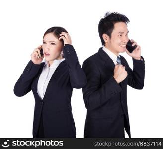 worried businesswoman and happy businessman talking on smartphone isolated on white background