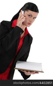 Worried businesswoman making call