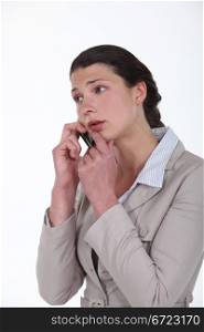 Worried businesswoman on a cellphone