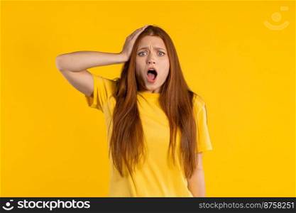 Worried confused woman, no, she forgot. Shocked girl feeling sorrow, regret, drama, failure, problems on yellow background. High quality photo. Worried confused woman, no, she forgot. Shocked girl feeling sorrow, regret, drama, failure, problems on yellow background.