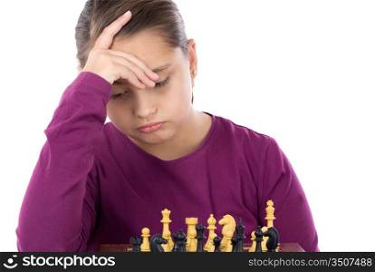 Worried little girl playing chess on a over white background