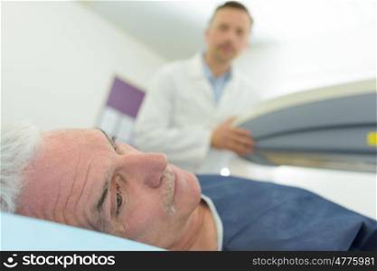 worried man doctor analyzing male patient with ultrasound