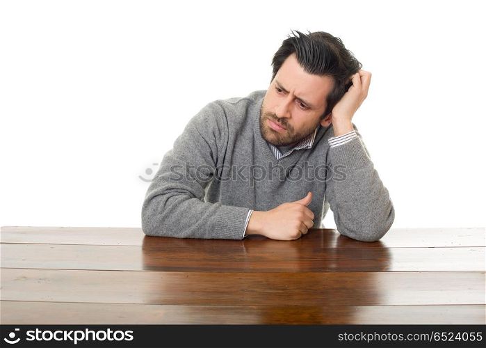 worried man on a desk, isolated on white background. worried man