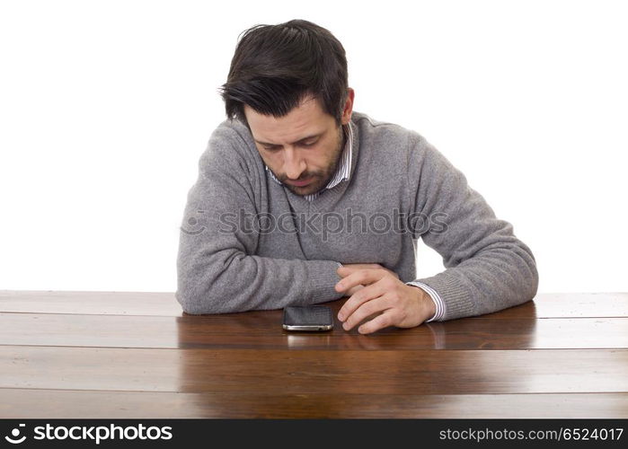 worried man on a desk on the phone, isolated. on the phone