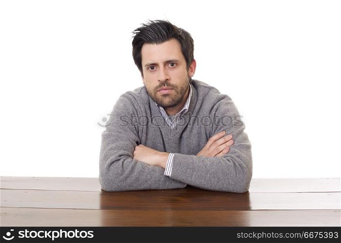 worried man on a desk with a tablet pc, isolated. worried man on a desk