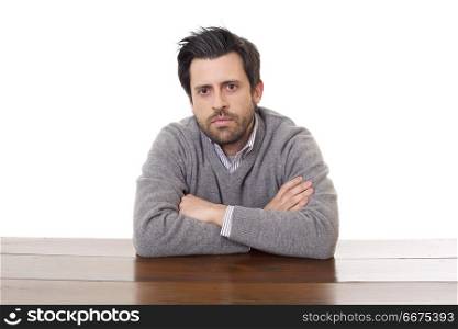 worried man on a desk with a tablet pc, isolated. worried man on a desk