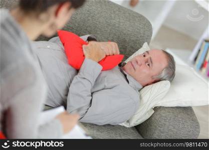 worried man on psychotherapy with doctor