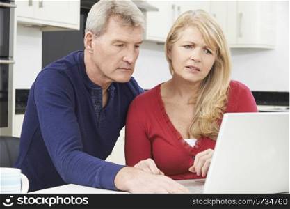 Worried Mature Couple Reviewing Domestic Finances