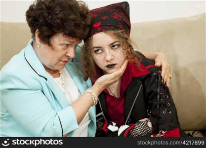 Worried mother trying to talk with her angry teenage daughter.
