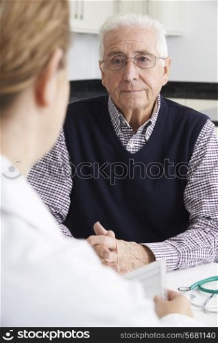 Worried Senior Man Meeting With Doctor In Surgery