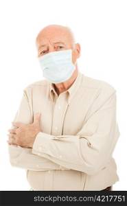 Worried senior man wearing a surgical face mask to protect against an epidemic. Isolated on white.