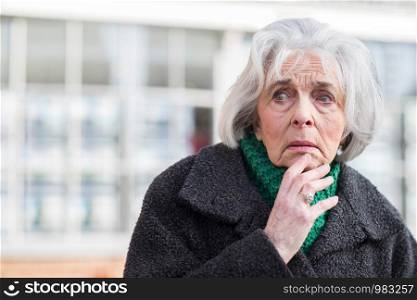 Worried Senior Woman Looking Lost Outdoors
