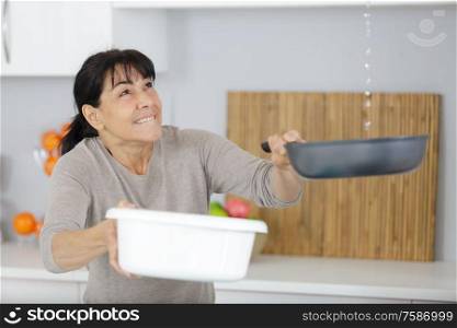 worried woman about home leaks in the living room