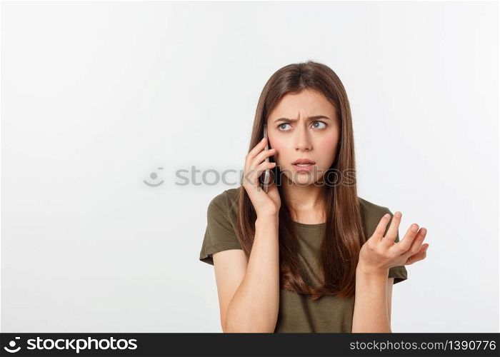 Worried young woman looks nervously, Female is nervous while talking on the phone, feels frustrated and worrying phone talk concept.. Worried young woman looks nervously, Female is nervous while talking on the phone, feels frustrated and worrying phone talk concept