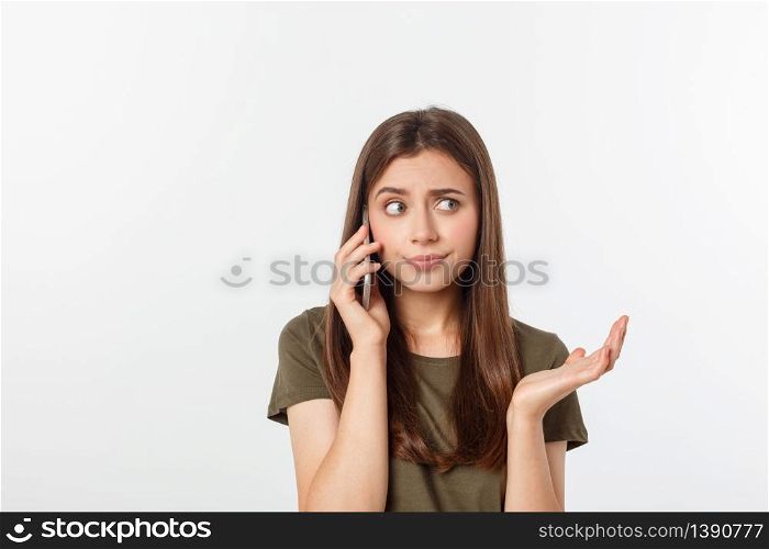 Worried young woman looks nervously, Female is nervous while talking on the phone, feels frustrated and worrying phone talk concept.. Worried young woman looks nervously, Female is nervous while talking on the phone, feels frustrated and worrying phone talk concept