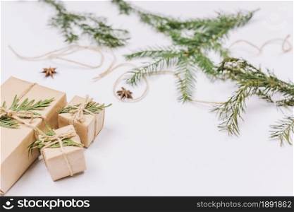 wrapped christmas gifts near coniferous twigs. Resolution and high quality beautiful photo. wrapped christmas gifts near coniferous twigs. High quality and resolution beautiful photo concept
