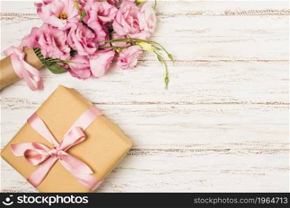 wrapped pink eustoma flower gift box white old table. High resolution photo. wrapped pink eustoma flower gift box white old table. High quality photo