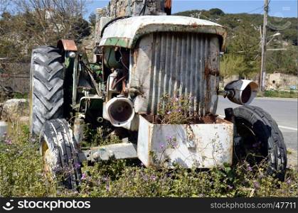 Wreck of an old tractor on a tray of mountain it Greece