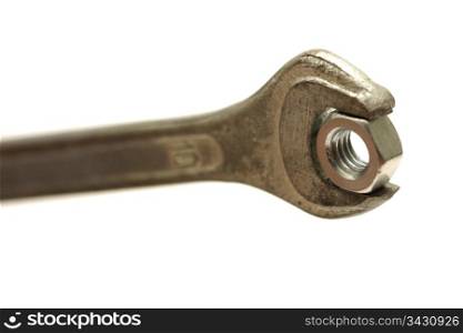 Wrench with screw nut isolated on white background