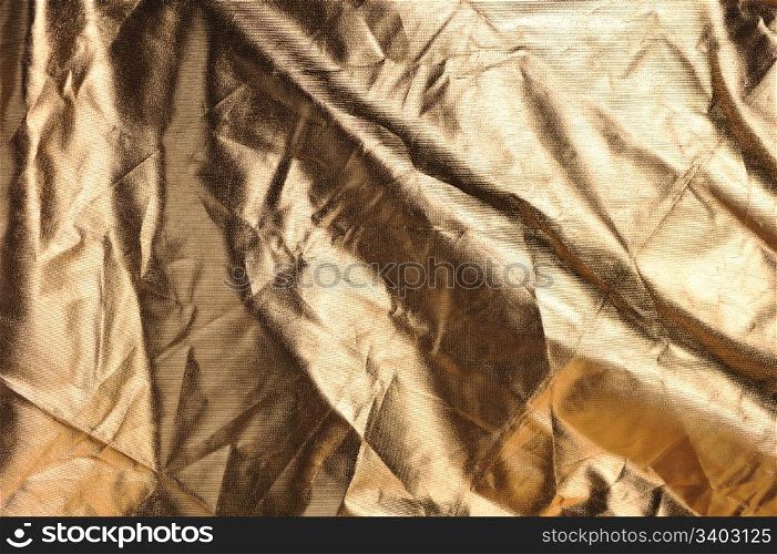 Wrinkled golden canvas, abstract background