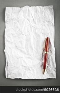 Wrinkled paper background with pen