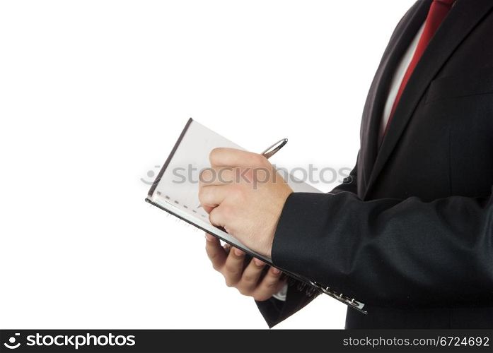 Writing hand on white page with a pen