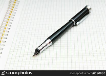 Writing pen on the blank page
