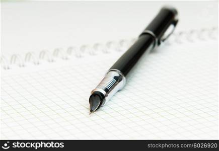 Writing pen on the blank page