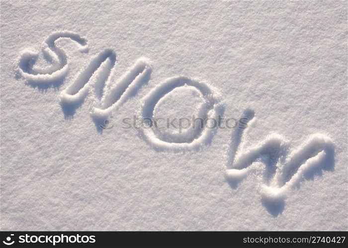 "writing text "SNOW" in sunny day on the snow"