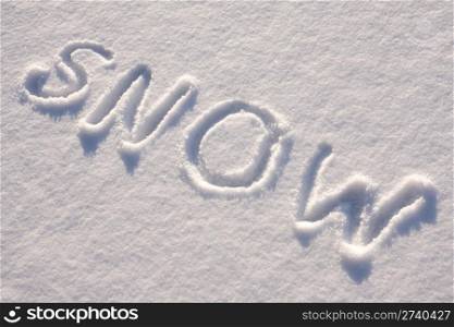 "writing text "SNOW" in sunny day on the snow"