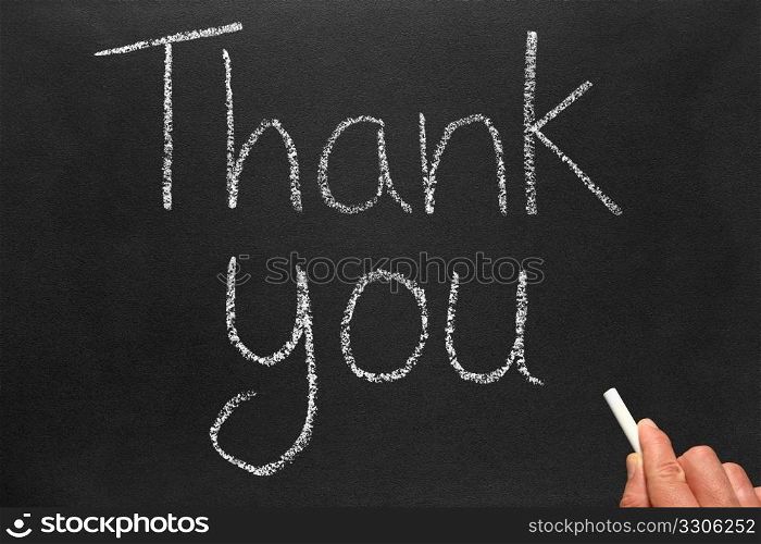 Writing thank you on a blackboard.