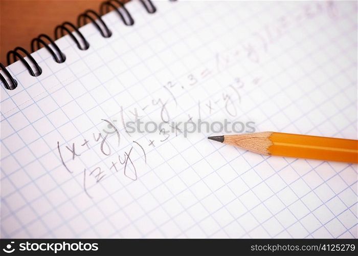 writing yellow pencil in closeup, selective focus on center