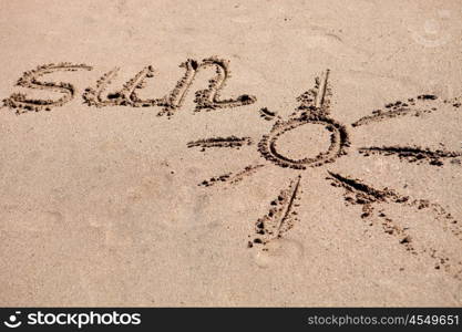 Written on the sand of the beach: Sun