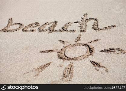 Written on the sand the word Beach