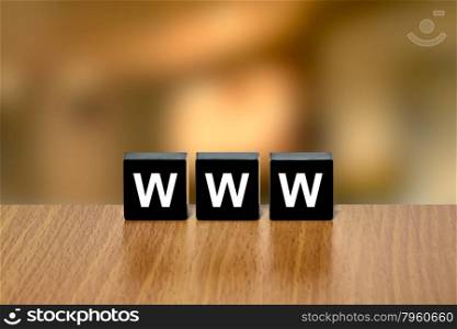 www or World Wide Web on black block with blurred background