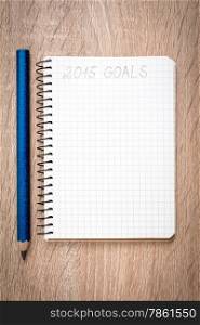 &#x9;Notebook with pencil and goals of year 2015